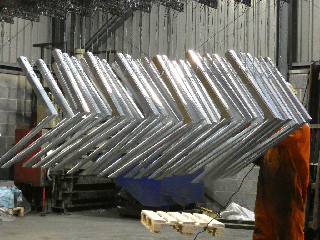 awkwardly shaped steel metal structures ready to be galvanised